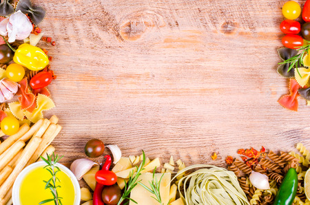 Ingridients for traditional italian dishes on wooden background. Free space for your textの写真素材