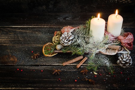 Christmas decoration with candles, christmas ball, ribbon, fir cone, tree, anice star, cinamon. Wooden Background For Copy Space. Vintage Styleの写真素材