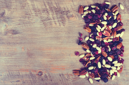 Dried fruits assortment on dark background, health food concept. Tonedの写真素材