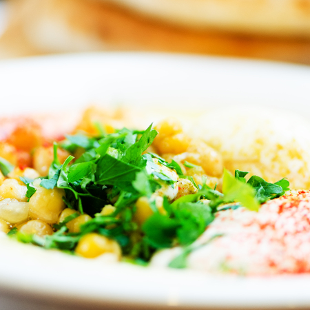Classic hummus with parsley and pita. Traditional jewish food and middle eastern cuisine recipeの写真素材