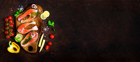 Salmon fillet, fish on wooden background with free space for your text. Top view. Healthy food, diet or cooking concept. Bannerの写真素材