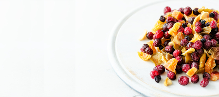 Mix of dried fruits on stone. Cranberry, rhubarb, apple, mango, cherry, peach, apricot. Handmade sweets no sugar. Healthy nutrition, high dose vitamin C. Banner.の写真素材