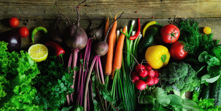 Vegetables on wooden background. Bio healthy organic food, herbs and spices. Raw and vegetarian...