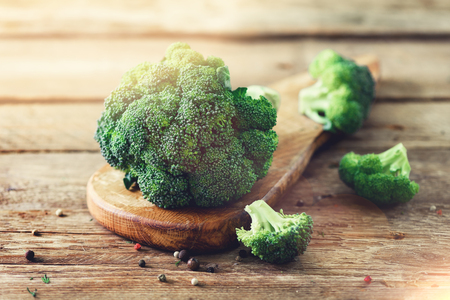 Fresh organic broccoli on wooden table close up with copyspaceの写真素材