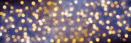 Festive glittering christmas lights. Blurred abstract background with bokeh. Copy space. Bannerの写真素材