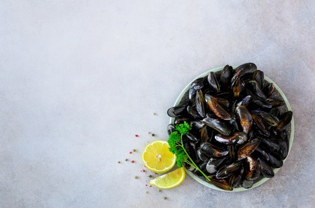 Mussels on stone concrete background. Top view, copy space