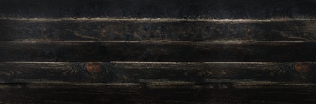 Black painted wood texture background, copy space, top view. Bannerの写真素材