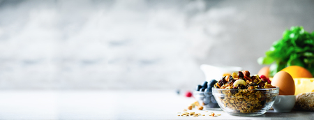 Homemade granola with milk, fresh berries, milk for breakfast. Copy space. Healthy breakfast concept. Bannerの写真素材
