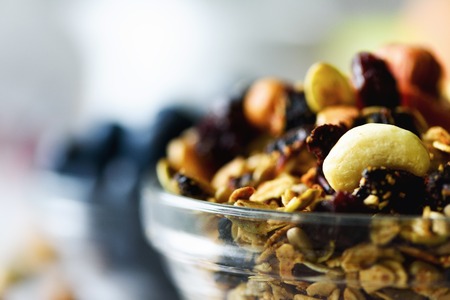 Homemade granola with milk, fresh berries, milk for breakfast. Copy space. Healthy breakfast conceptの写真素材
