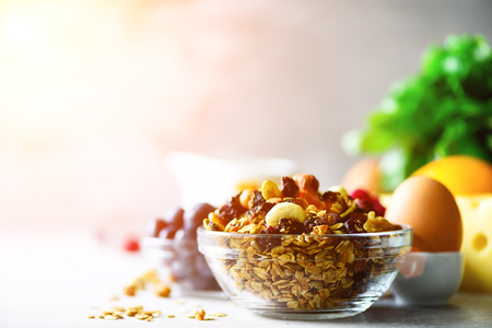 Homemade granola with milk, fresh berries, milk for breakfast. Copy space. Healthy breakfast concept. Sunny morningの写真素材