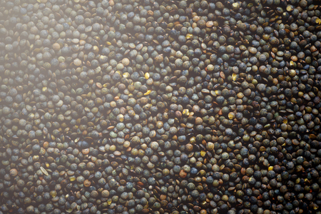 Raw organic marbled green lentils texture.の写真素材