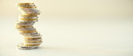 Euro coins stack on grey background with copy space. Banner.の写真素材