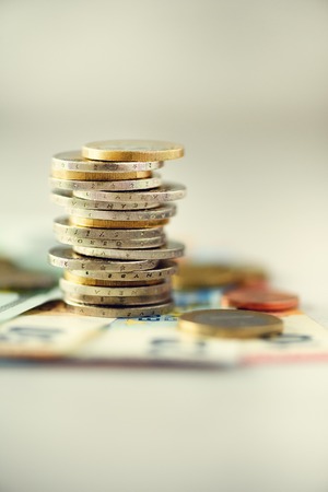 Euro coins stack on grey background with copy spaceの写真素材