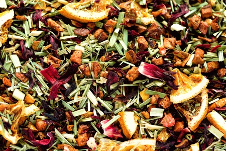 Mix tea karkade with dried fruits and flowers. Fruit tea background and texture. Top view. Food...