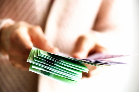 Woman hands holding euro currency money banknotes. Payment and cash concept. Copy space.の写真素材