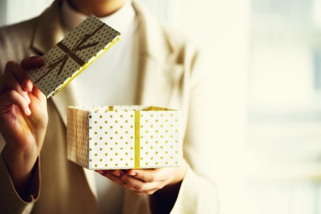 Female hands opening gift box, copy space. Christmas, hew year, birthday concept. Bannerの写真素材