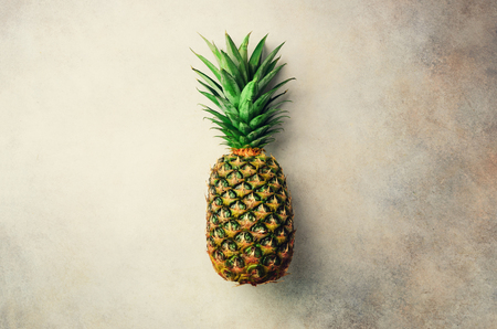 Pineapple on gray background, top view, copy space. Minimal design. Vegan and vegetarian concept.の写真素材