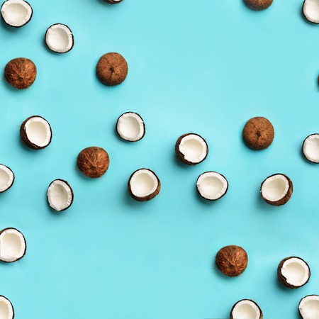 Pattern with ripe coconuts on blue background. Square crop. Top View. Copy Space. Pop art design,...