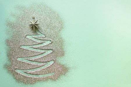 Shining christmas tree with sparkling glitter starの写真素材