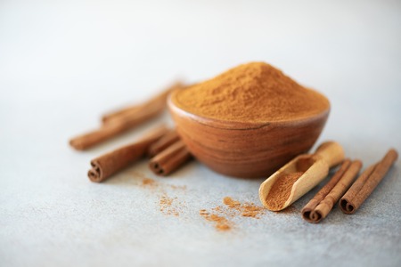 Cinnamon sticks and powder on greyの写真素材