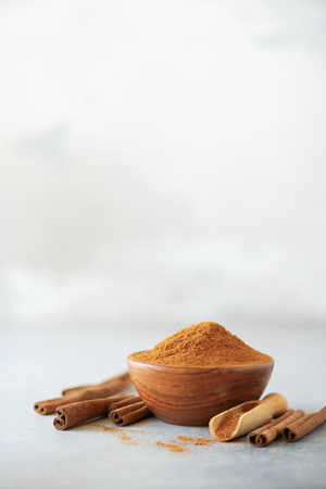 Cinnamon sticks and powder on greyの写真素材