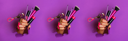 Pattern of woman hands with professional cosmetic tools for make upの写真素材