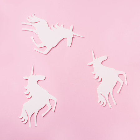 Creative unicorn pattern on pink background. Abstract art texture Minimal fantasy concept. Banner. Square crop.の写真素材
