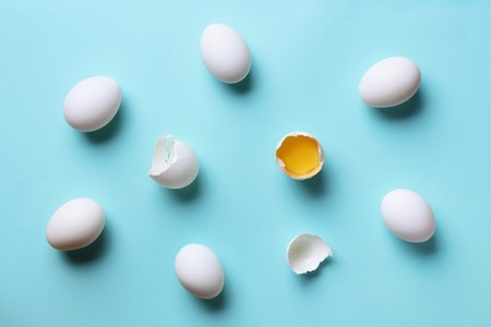 Food concept with white eggs on blue background. Top view. Creative pattern in minimal style. Flat...