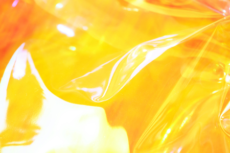 Neon holographic background. Wallpaper hologram with copy space. Wrinkled abstract texture with multiple colorsの写真素材