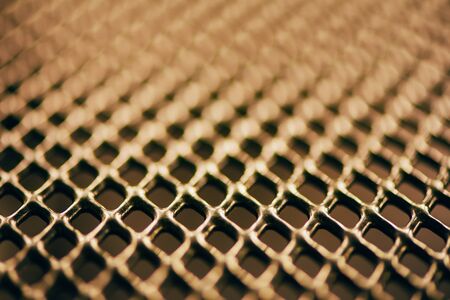 Metal background. Lattice texture with small cells grid. Selective focus pointの写真素材