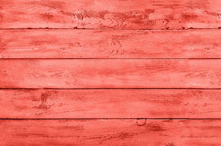 Wooden background. Vintage rustic texture, wallpaper in trendy living coral color. Top view, copy space. Bannerの写真素材
