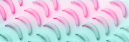 Geometric colorful fruit pattern. Bananas over rainbow gradient background. Banner. Top view. Pop...