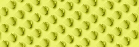 Pattern from pastel cups over trendy yellow color background. Birthday party celebration, baby...