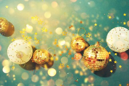 Christmas composition. Flat lay, top view. Disco ball bauble, star sparkles. Minimal New year party...
