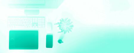 Keyboard, mouse, computer display with black blank screen. Trendy green and turquoise color. Designer workspace on mint color background. Minimalistic home office. Copy space. Banner.の写真素材