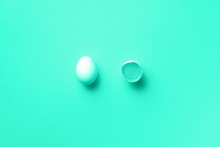 Food concept with white chicken eggs on trendy gradient background. Top view. Creative pattern in...