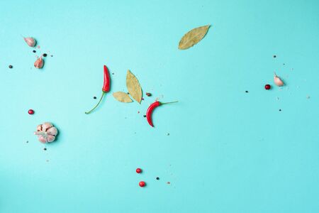 Ingredients for marinated gherkins, pickled cucumbers on blue background. Culinary recipe. Concept...