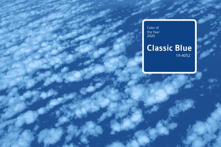 Clouds and sky view from airplane window. Abstract monochrome texture. Trendy blue and calm color....