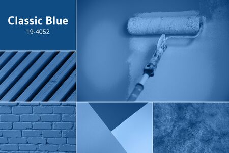 Painting wall with paint roller in monochrome color. Appartment renovation, repair, building and home concept. Trendy classic blue color background. Copy space, banner. Tools for painting wallsの写真素材