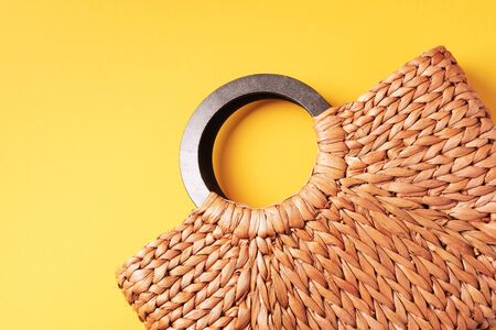 Handmade summer bag on trendy yellow background. Top view. Fashionable stylish accessory. Natural, organic, eco friendly, zero waste, plastic free concept.の写真素材