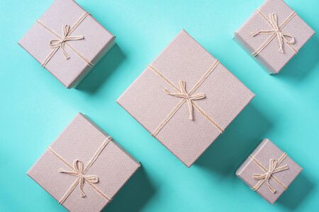 Valentine's Day. Golden gift box on blue background. Top view. Copy space. Festive backdrop for holidays: Birthday, Valentines day, Christmas, New Year. Flat lay style. Banner.の写真素材