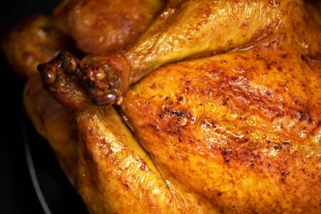 Roasted chicken in baking dish. Top view. Copy space. Macro shoot, selective focus.の写真素材