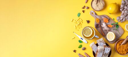 Medical care concept. Cold, flu treatment. Ginger, lemon, honey, pills, drugs, supplements,...