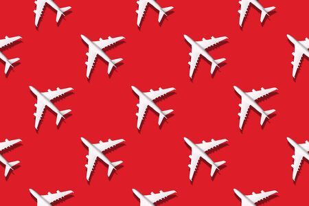 Summer pattern. Creative banner of white planes on bright background. Travel, vacation concept. Travel, vacation ban. Flights cancelled and resumed again. Top view. Flat lay. Minimal style designの写真素材