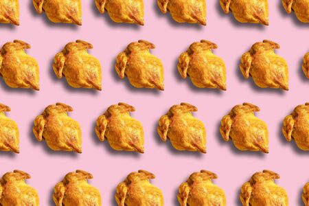 Colorful pattern of roasted chicken or turkey on pink background. Top view. Creative design for packaging. Food seamless pattern. Thanksgiving day conceptの写真素材