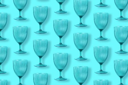 Champagne glass pattern on blue background with copy space for text. Top view. Holiday and celebration concept. Packing design. Creative design, minimal flat lay conceptの写真素材
