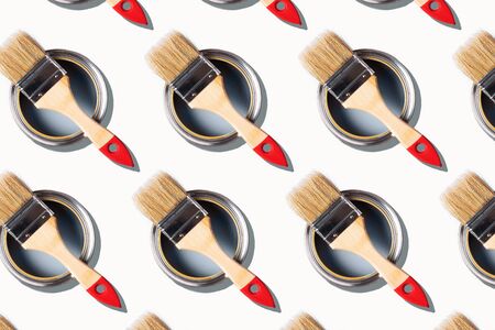 Brush and open paint can pattern on white background. Top view, copy space. Creative design for packaging. Appartment renovation, repair, building and home design conceptの写真素材