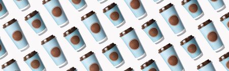 Take away tea or coffee cup on white background. Top view. Copy space. Creative design for...