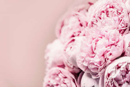 Wedding, birthday, anniversary bouquet. Pink peony flower on pastel background. Copy space. Trendy pastel floral composition. Woman day, Mothers day. Macro of peonies flowersの写真素材