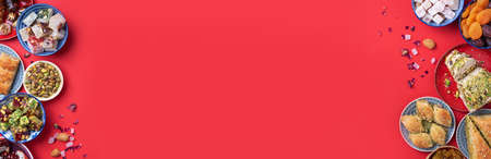 Baklava, halva, rahat lokum, sherbet, nuts, pistachios, dates, raisins, dried apricots, churchkhela. Assorted traditional eastern desserts, arabian sweets, turkish delight. Top view. Flat layの写真素材